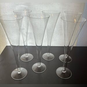 6 hollow stem glass champagne flutes.